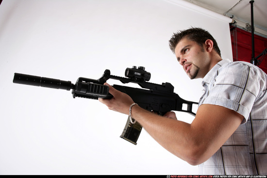 Man Adult Average White Fighting with submachine gun Standing poses Casual