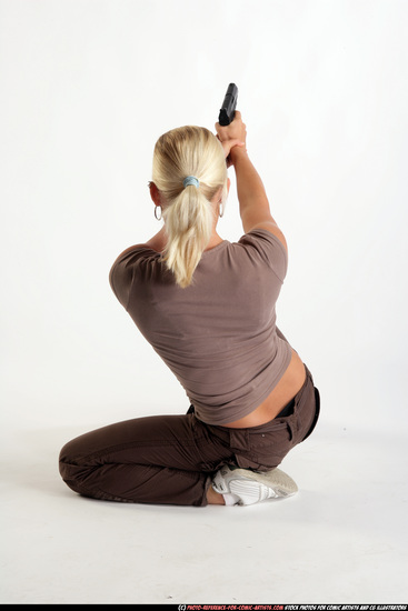 Woman Adult Athletic White Fighting with gun Kneeling poses Sportswear