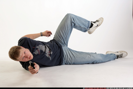 Man Adult Average White Fighting with gun Laying poses Sportswear