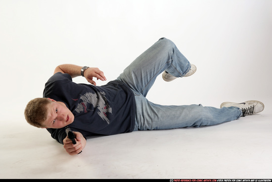 Man Adult Average White Fighting with gun Laying poses Sportswear