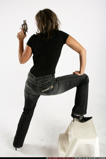 Woman Adult Average White Fighting with gun Standing poses Sportswear