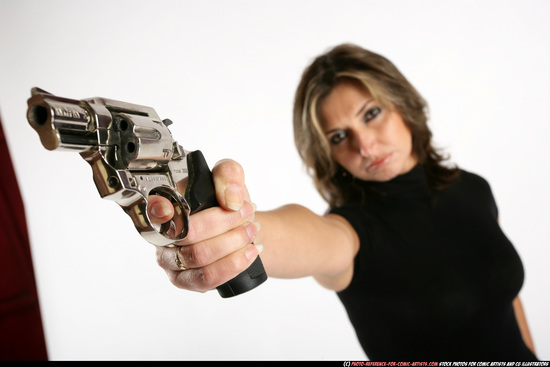 Woman Adult Average White Fighting with gun Standing poses Sportswear