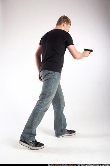 Man Adult Average White Fighting with gun Standing poses Sportswear