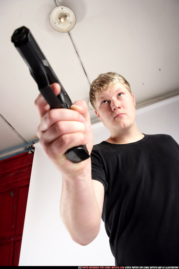 Man Adult Average White Fighting with gun Standing poses Sportswear