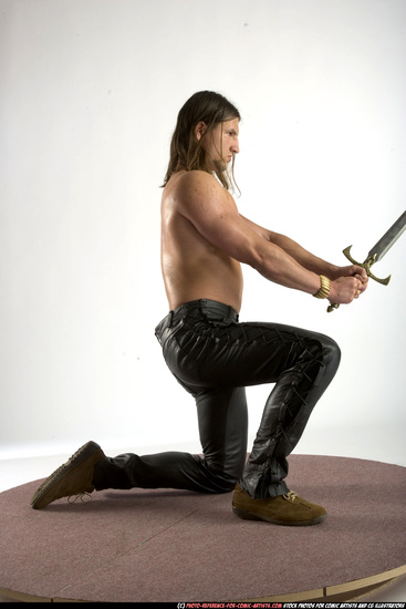 Man Adult Muscular White Fighting with sword Kneeling poses Pants