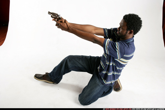 Man Young Athletic Black Fighting with gun Kneeling poses Sportswear