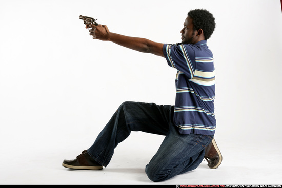 Man Young Athletic Black Fighting with gun Kneeling poses Sportswear