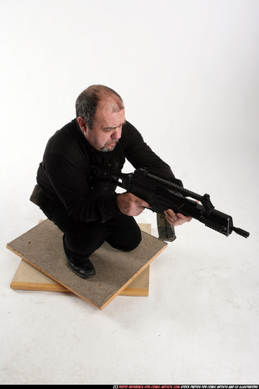 Man Old Chubby White Fighting with submachine gun Kneeling poses Casual