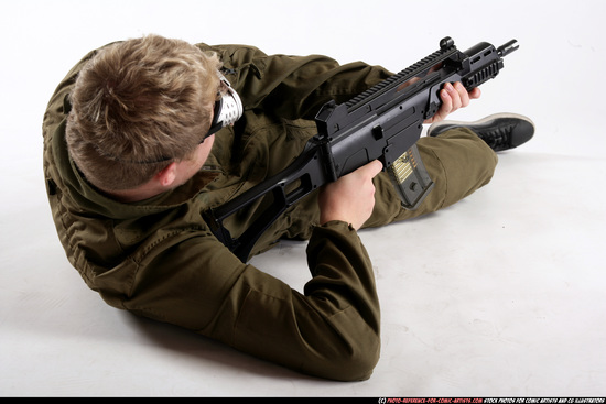 Man Adult Average White Fighting with submachine gun Laying poses Army