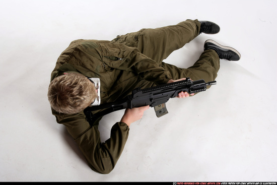 Man Adult Average White Fighting with submachine gun Laying poses Army