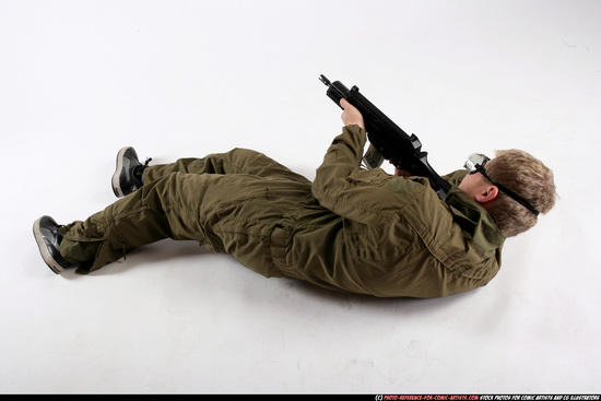 Man Adult Average White Fighting with submachine gun Laying poses Army