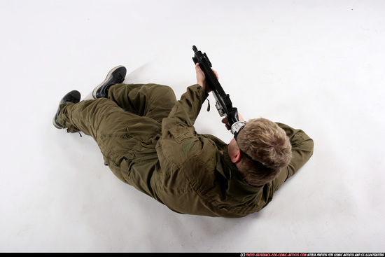 Man Adult Average White Fighting with submachine gun Laying poses Army