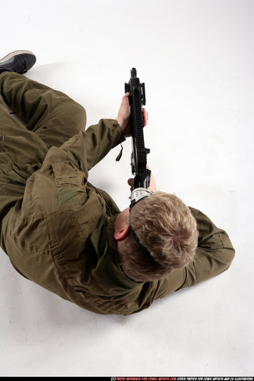 Man Adult Average White Fighting with submachine gun Laying poses Army