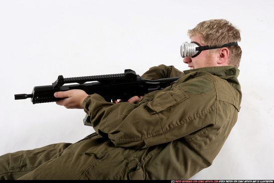 Man Adult Average White Fighting with submachine gun Laying poses Army