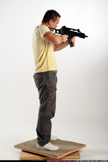 Man Adult Athletic White Fighting with submachine gun Standing poses Sportswear