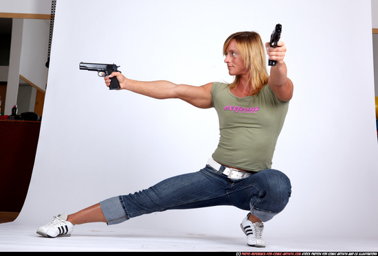 Woman Adult Muscular White Fighting with gun Kneeling poses Sportswear