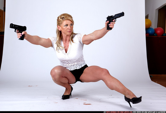 Woman Adult Muscular White Fighting with gun Kneeling poses Sportswear