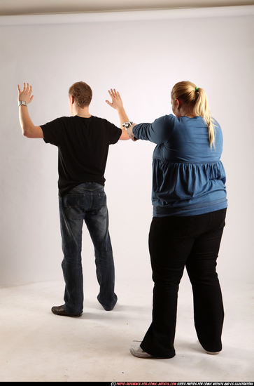 Man & Woman Adult Average White Fighting with gun Standing poses Casual