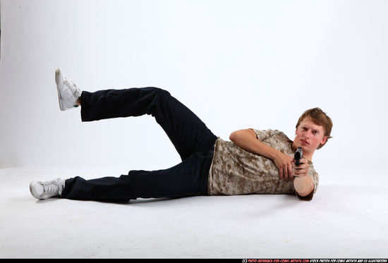 Man Young Athletic White Fighting with gun Laying poses Sportswear