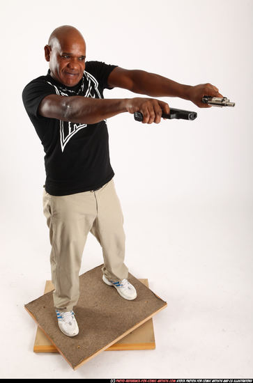 Man Old Average Black Fighting with gun Standing poses Casual