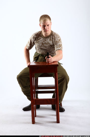 Man Adult Average White Fighting with gun Sitting poses Army