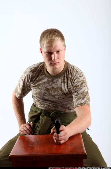 Man Adult Average White Fighting with gun Sitting poses Army