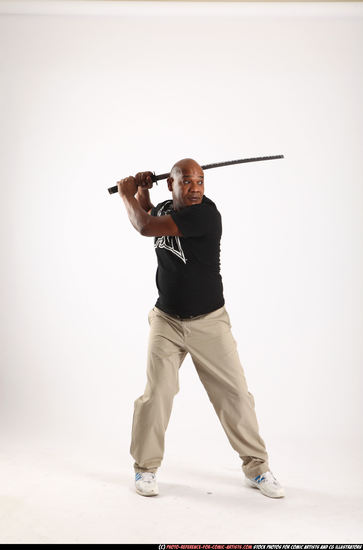 Man Old Average Black Fighting with sword Standing poses Casual