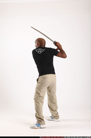 Man Old Average Black Fighting with sword Standing poses Casual