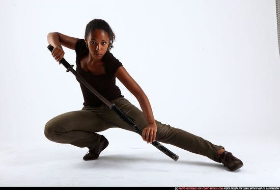 Woman Young Athletic Black Fighting with sword Kneeling poses Casual