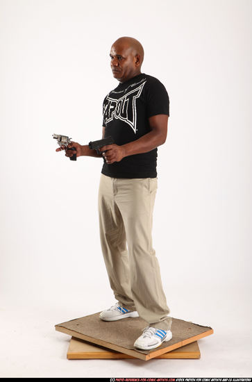 Man Old Chubby Black Fighting with gun Standing poses Casual