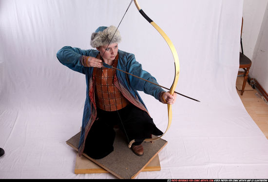 Woman Adult Average White Fighting with bow Kneeling poses Army