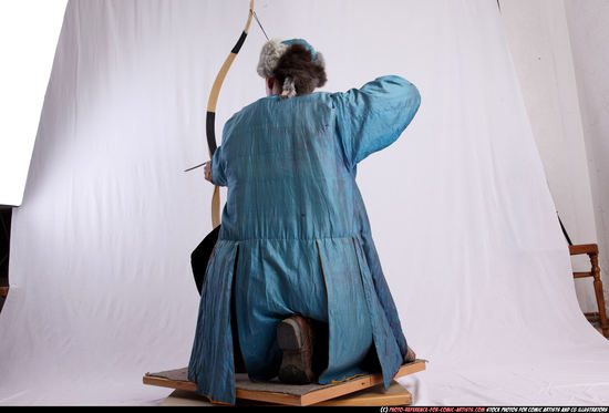 Woman Adult Average White Fighting with bow Kneeling poses Army