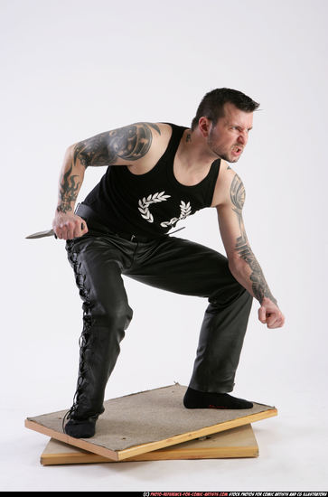 Man Adult Athletic White Fighting with knife Crouching Casual