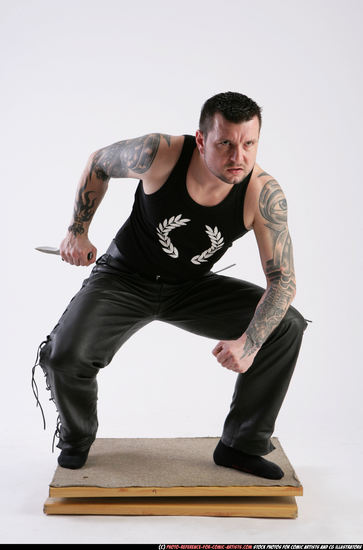 Man Adult Athletic White Fighting with knife Crouching Casual