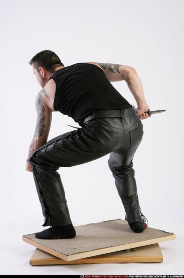 Man Adult Athletic White Fighting with knife Crouching Casual