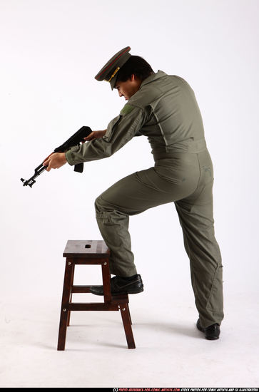 Man Adult Average Fighting with submachine gun Standing poses Army Asian