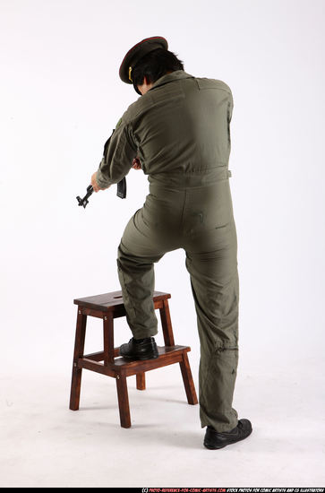 Man Adult Average Fighting with submachine gun Standing poses Army Asian