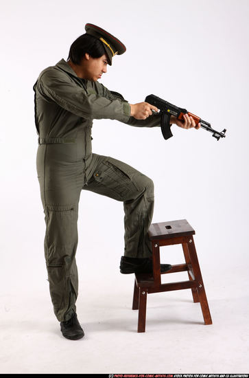 Man Adult Average Fighting with submachine gun Standing poses Army Asian