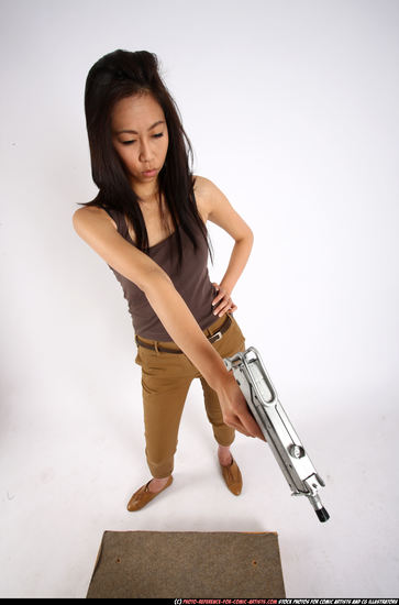 Woman Young Athletic Fighting with submachine gun Standing poses Army Asian