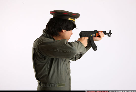 Man Adult Average Fighting with submachine gun Detailed photos Army Asian