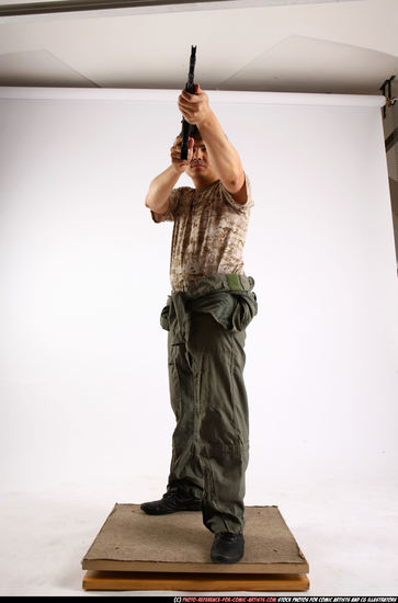 Man Adult Average Fighting with submachine gun Standing poses Army Asian