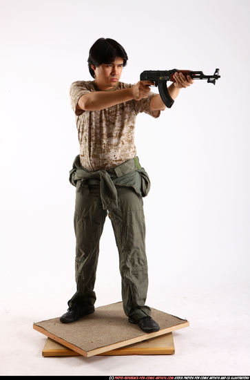 Man Adult Average Fighting with submachine gun Standing poses Army Asian