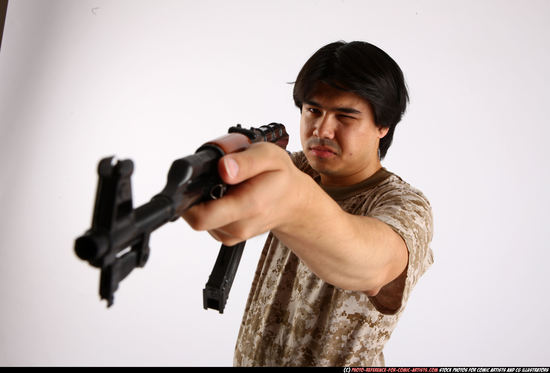 Man Adult Average Fighting with submachine gun Standing poses Army Asian