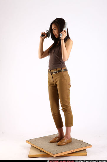 Woman Young Athletic Fighting with gun Standing poses Casual Asian