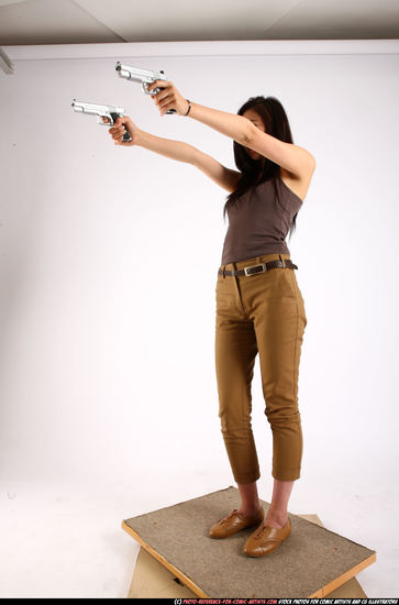 Woman Young Athletic Fighting with gun Standing poses Casual Asian