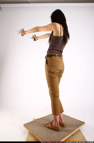 Woman Young Athletic Fighting with gun Standing poses Casual Asian