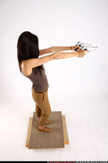 Woman Young Athletic Fighting with gun Standing poses Casual Asian