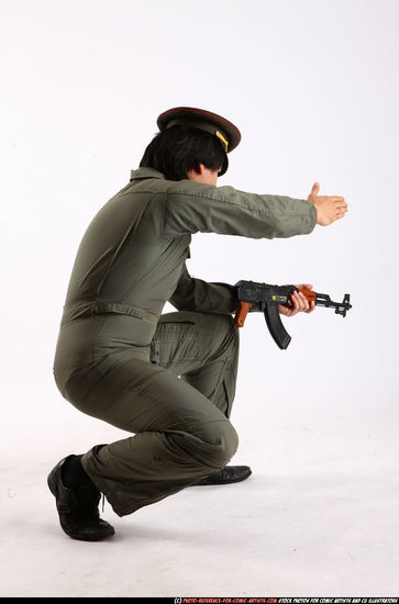 Man Adult Average Fighting with submachine gun Kneeling poses Army Asian