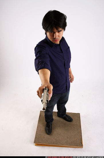 Man Adult Average Fighting with gun Standing poses Casual Asian