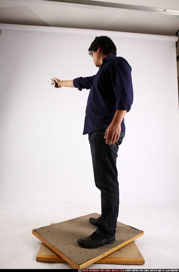 Man Adult Average Fighting with gun Standing poses Casual Asian